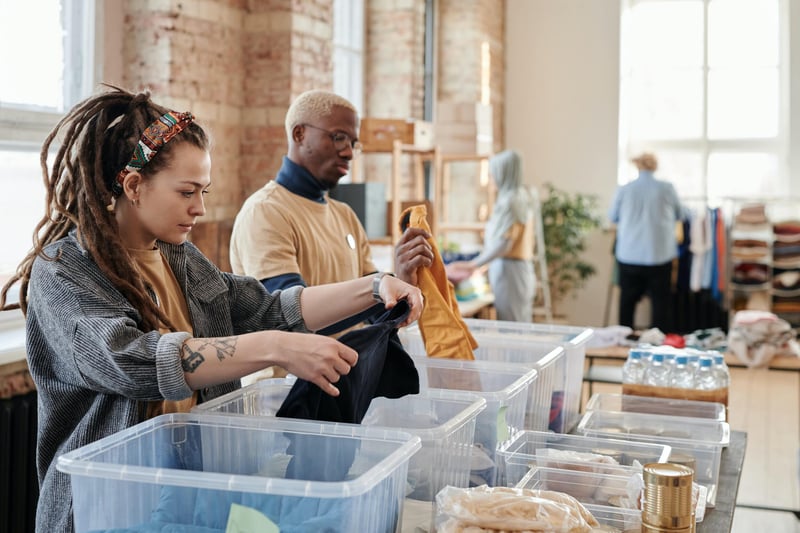 Volunteers sorting clothes for donation