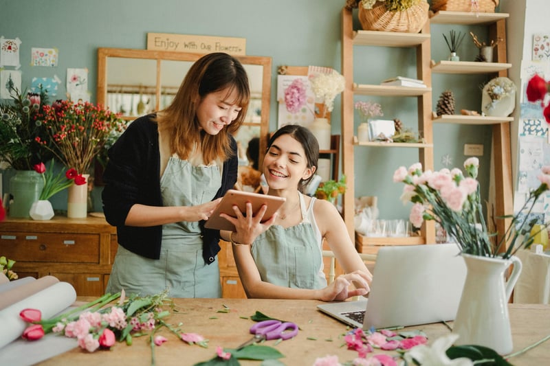 Two small business owners using AP automation software for a small business