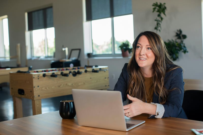 Manager doing expense reconciliation on her laptop
