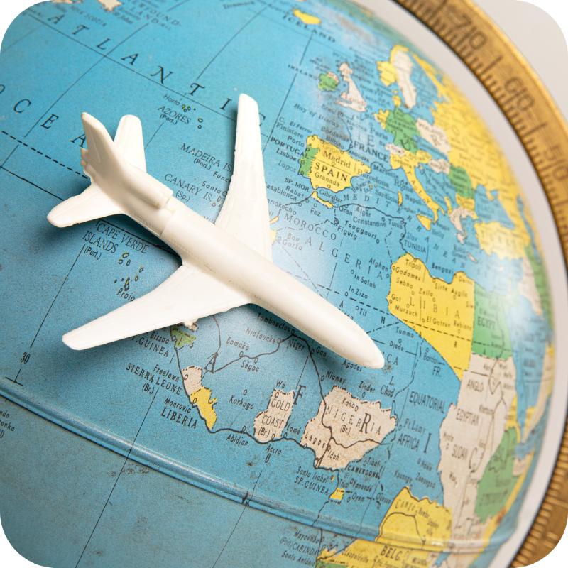 Toy airplane travelling around the globe